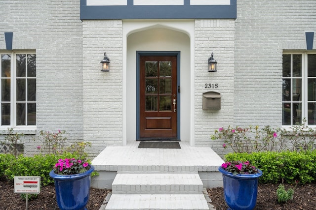 entrance to property with brick siding