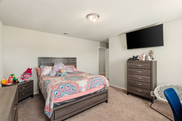 bedroom featuring light carpet, visible vents, and baseboards