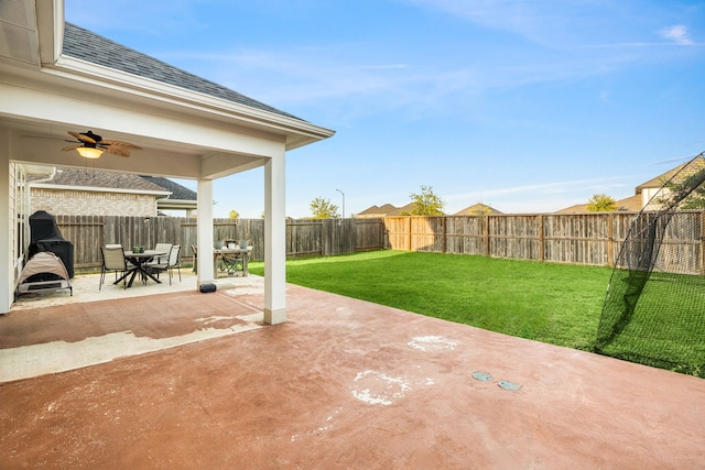 view of patio with outdoor dining space, ceiling fan, and a fenced backyard