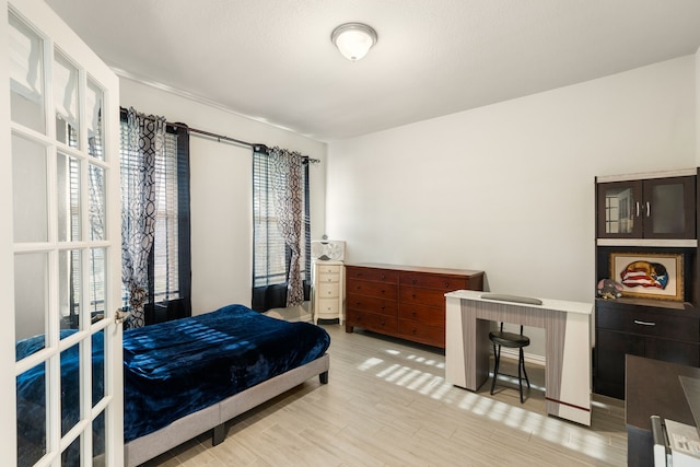 bedroom with light wood-type flooring