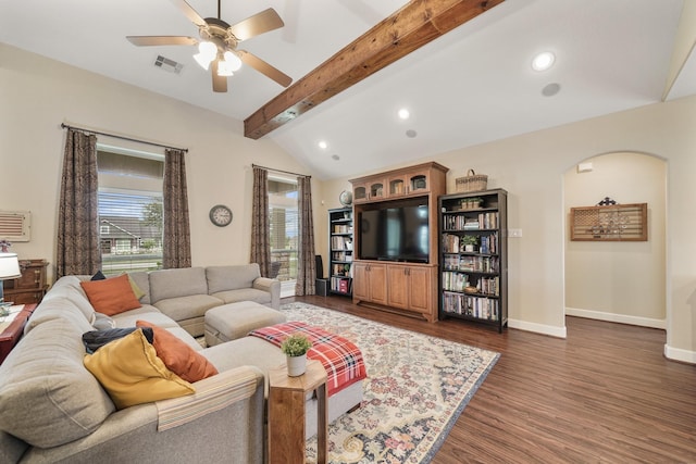 586 Ruby Dr, Bellville, TX 77418 - living area featuring arched walkways, dark wood finished floors, vaulted ceiling with beams, visible vents, and baseboards