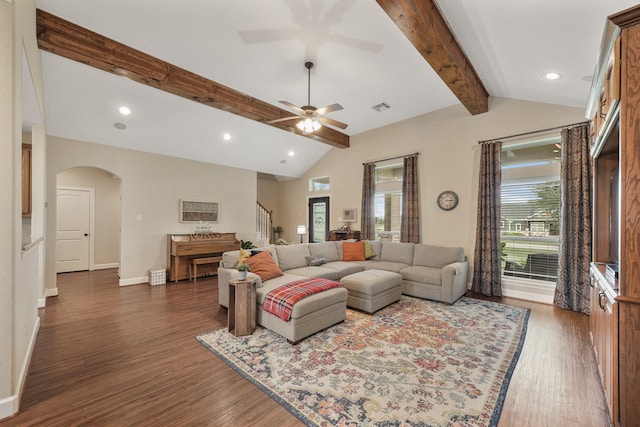 586 Ruby Dr, Bellville, TX 77418 - living area with baseboards, visible vents, arched walkways, lofted ceiling with beams, and dark wood-type flooring