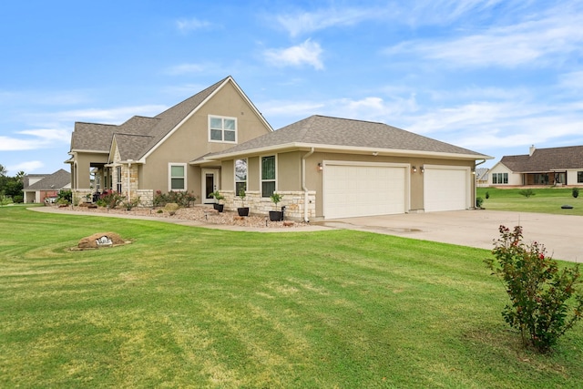 586 Ruby Dr, Bellville, TX 77418 - view of front of home with stucco siding, concrete driveway, an attached garage, stone siding, and a front lawn