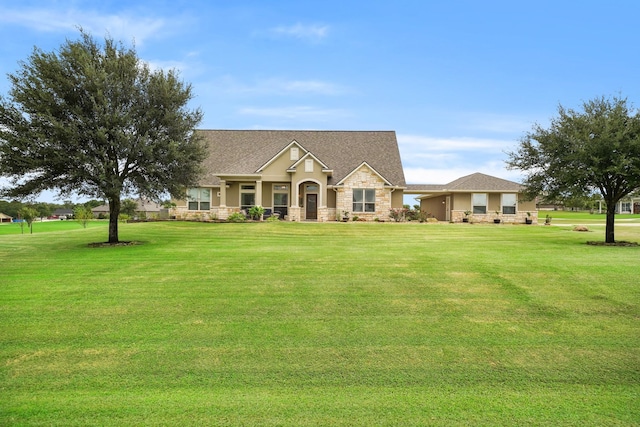 586 Ruby Dr, Bellville, TX 77418 - view of front of house with stone siding and a front yard