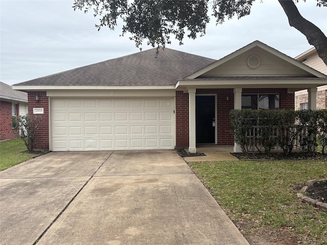 ranch-style home with a garage, driveway, brick siding, and a front yard