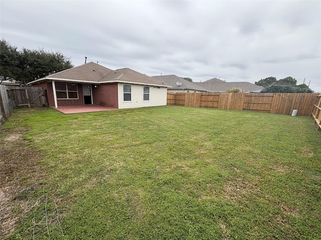 view of yard featuring a fenced backyard and a patio