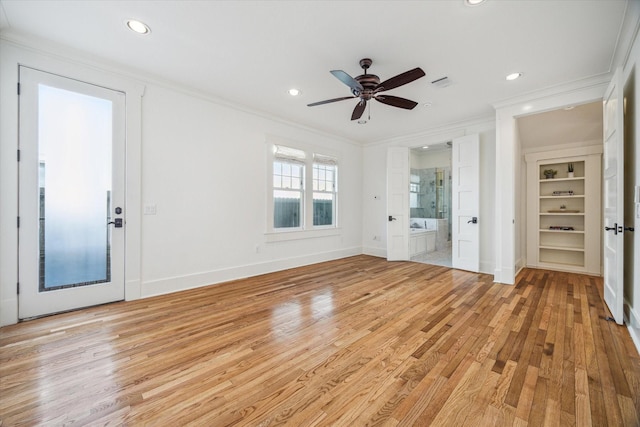 interior space featuring ornamental molding, light wood-type flooring, recessed lighting, and baseboards