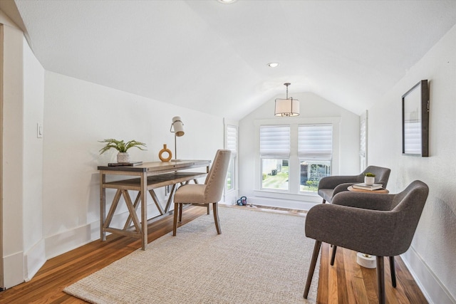 office space featuring lofted ceiling, recessed lighting, baseboards, and wood finished floors