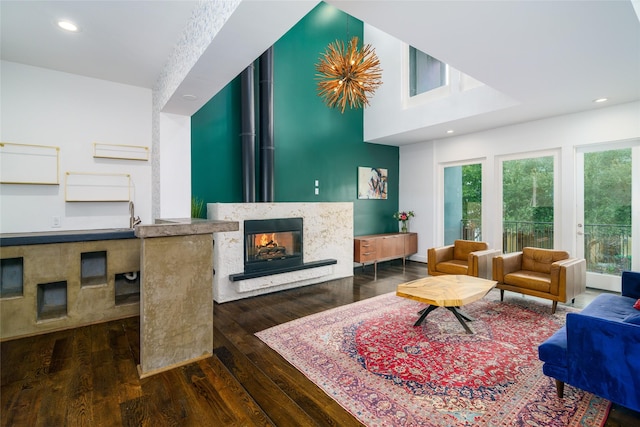 1016 Crocker St, Houston, TX 77019 - living room featuring dark wood-type flooring, a multi sided fireplace, and recessed lighting