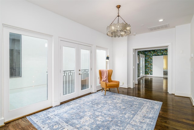 1016 Crocker St, Houston, TX 77019 - living area with a chandelier, visible vents, baseboards, french doors, and dark wood-style floors