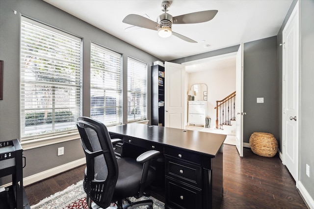 office area with dark wood-style floors, plenty of natural light, baseboards, and ceiling fan