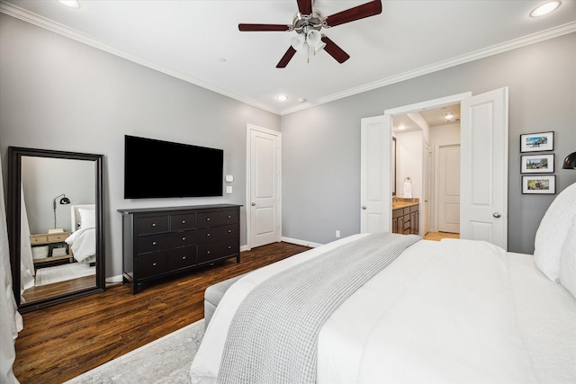 bedroom with dark wood-style floors, baseboards, and ornamental molding