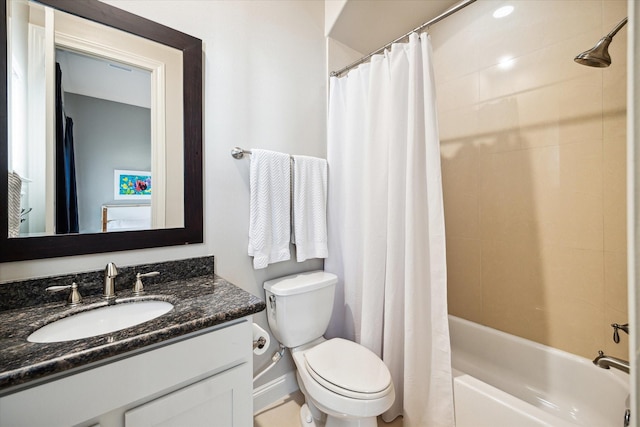 bathroom with toilet, shower / tub combo with curtain, and vanity