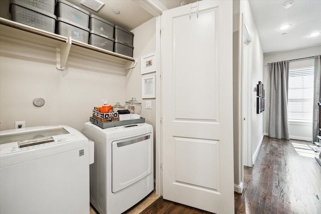 clothes washing area featuring dark wood-style floors, recessed lighting, washing machine and dryer, laundry area, and baseboards