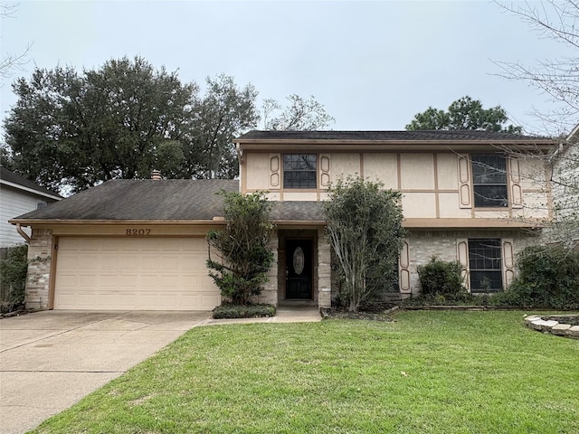 view of front facade featuring a front lawn, a garage, driveway, and stucco siding