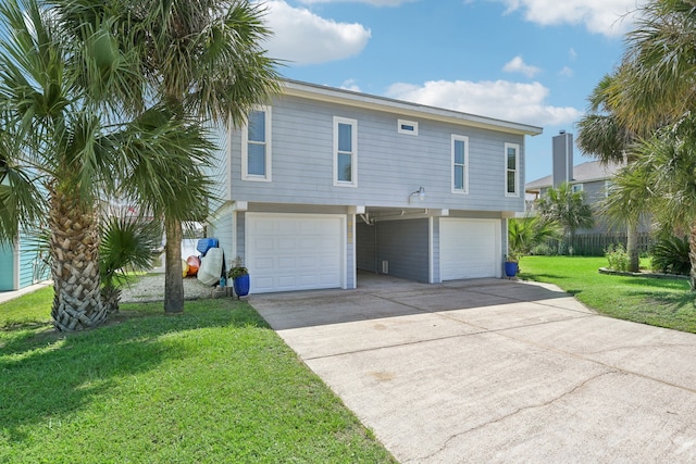 4105 Nueces Dr, Galveston, TX 77554 - raised beach house with a garage, concrete driveway, and a front yard