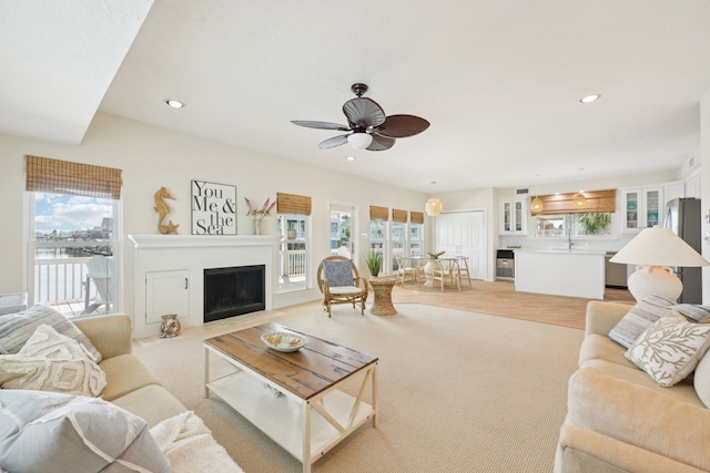 4105 Nueces Dr, Galveston, TX 77554 - living area featuring recessed lighting, a fireplace, plenty of natural light, and ceiling fan