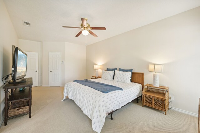 4105 Nueces Dr, Galveston, TX 77554 - bedroom with baseboards, visible vents, a ceiling fan, and light colored carpet