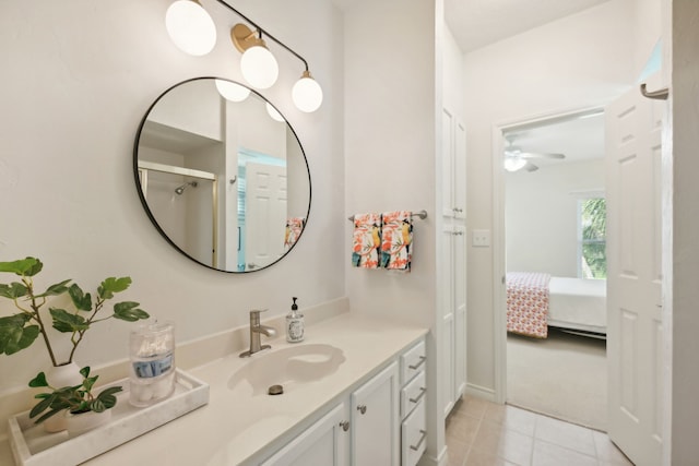 4105 Nueces Dr, Galveston, TX 77554 - ensuite bathroom with tile patterned flooring, connected bathroom, and vanity