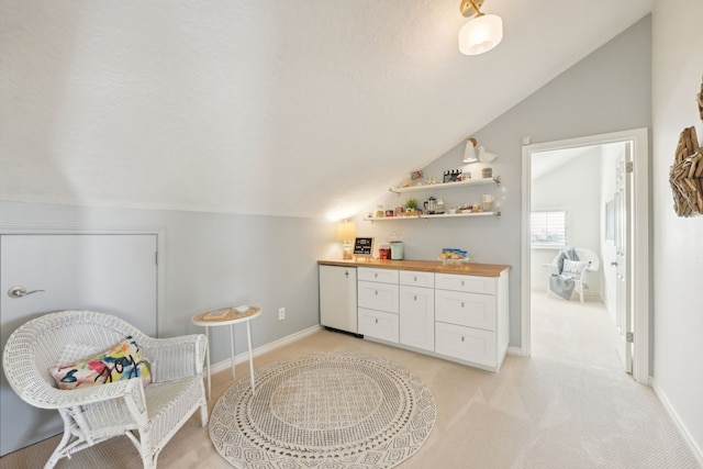 4105 Nueces Dr, Galveston, TX 77554 - living area featuring lofted ceiling, light carpet, and baseboards