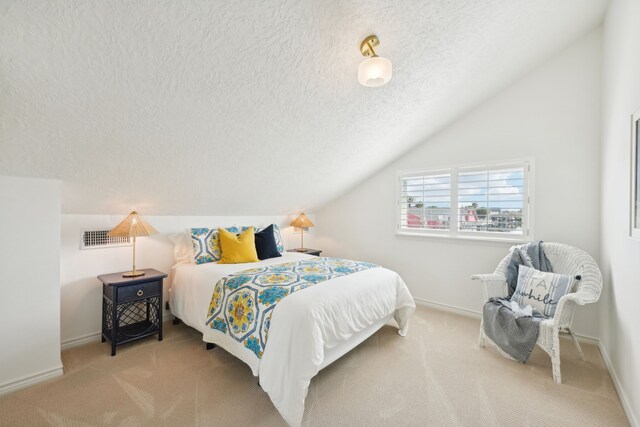 4105 Nueces Dr, Galveston, TX 77554 - carpeted bedroom featuring vaulted ceiling, a textured ceiling, visible vents, and baseboards