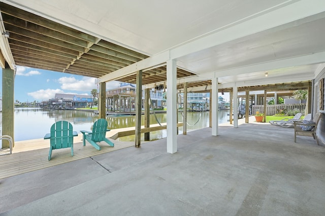 4105 Nueces Dr, Galveston, TX 77554 - view of patio / terrace with a water view and a boat dock