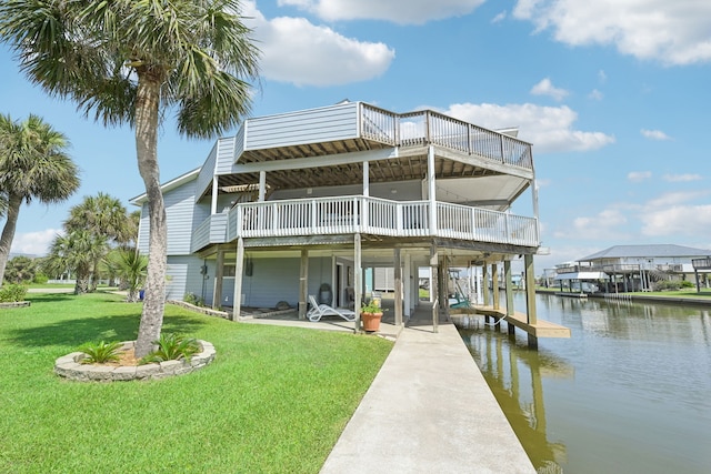 4105 Nueces Dr, Galveston, TX 77554 - back of property featuring a water view, a yard, and a patio