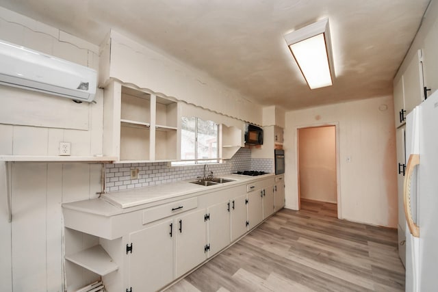 kitchen featuring white cabinetry, black appliances, and open shelves