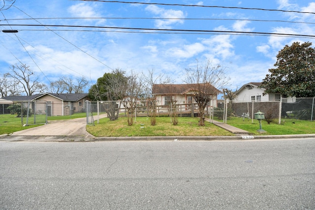 view of front of property with a fenced front yard, a residential view, and a front yard