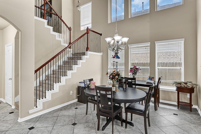 dining space featuring plenty of natural light and baseboards