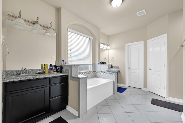 full bath with visible vents, vanity, tile patterned flooring, baseboards, and a bath