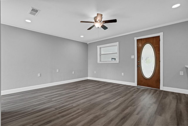 foyer with baseboards, visible vents, dark wood finished floors, and ornamental molding