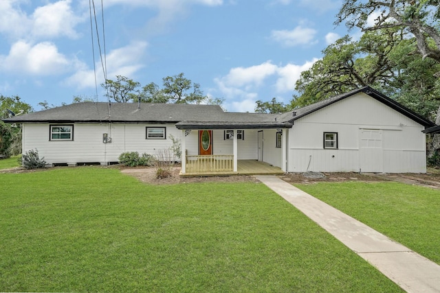 ranch-style house featuring a front yard and covered porch