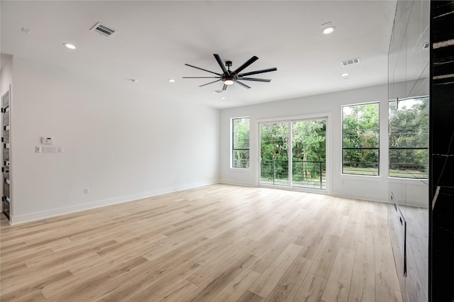 spare room with baseboards, recessed lighting, visible vents, and light wood-style floors