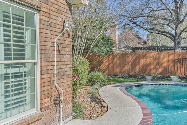 view of pool featuring fence and a fenced in pool