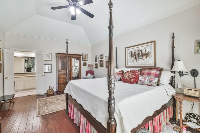 bedroom with a ceiling fan, lofted ceiling, ensuite bath, dark wood-style flooring, and crown molding