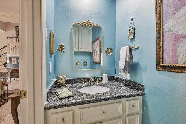 bathroom with tile patterned flooring and vanity