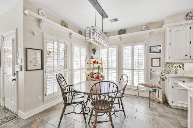 dining space with visible vents and baseboards