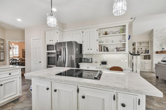 kitchen featuring open shelves, an inviting chandelier, white cabinetry, and stainless steel appliances