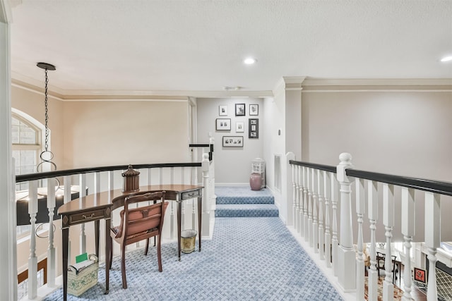 corridor with carpet, baseboards, crown molding, and an upstairs landing