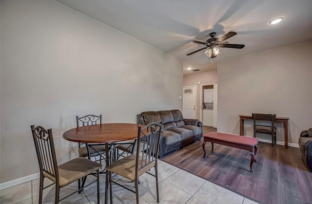 dining room featuring ceiling fan, baseboards, and light tile patterned floors