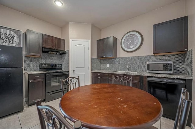 kitchen with black appliances, dark brown cabinets, a sink, and under cabinet range hood