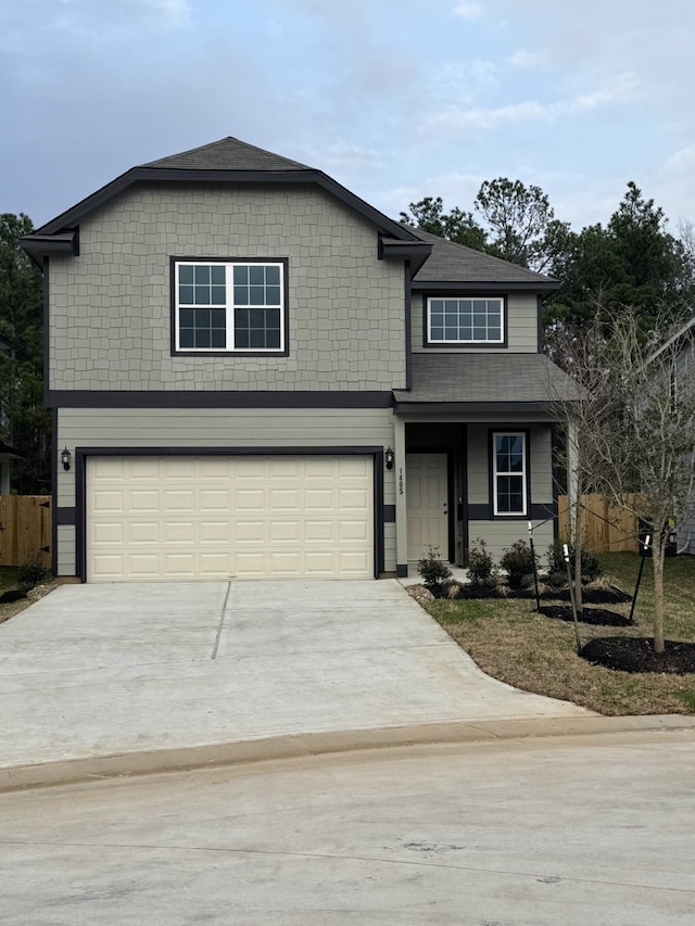 traditional-style home with a garage and concrete driveway