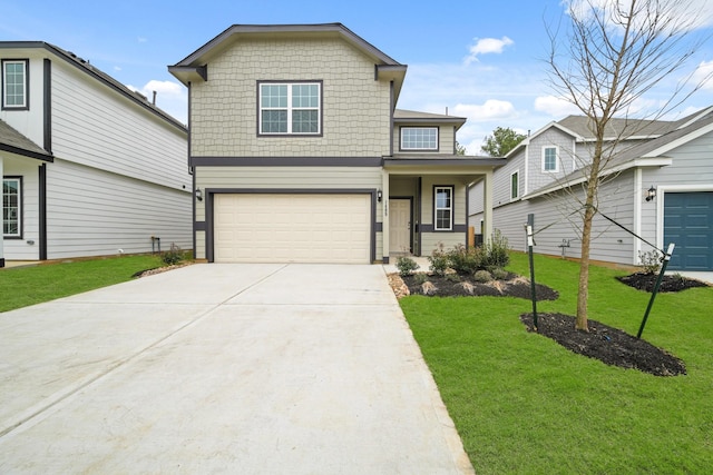 view of front of house featuring a garage, a front yard, and concrete driveway