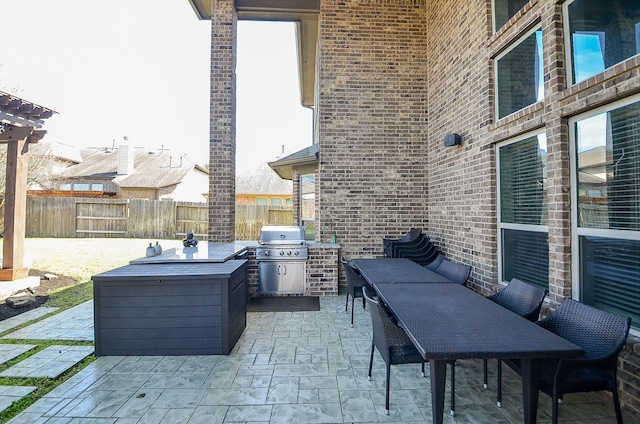 view of patio / terrace with fence and grilling area