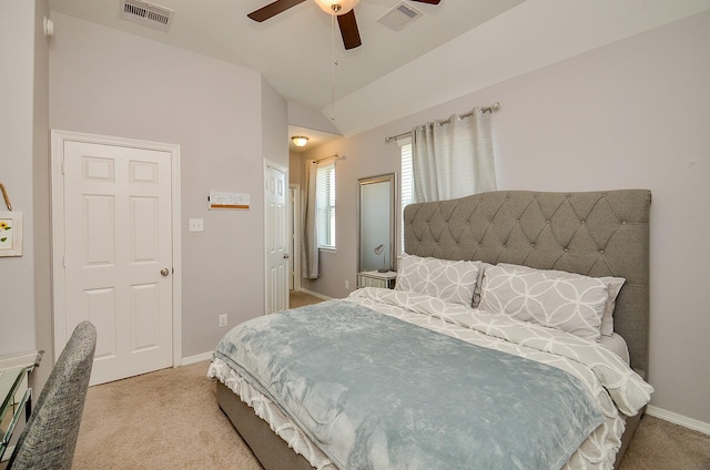 carpeted bedroom with lofted ceiling, visible vents, and baseboards