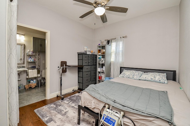 bedroom featuring ceiling fan, baseboards, and wood finished floors