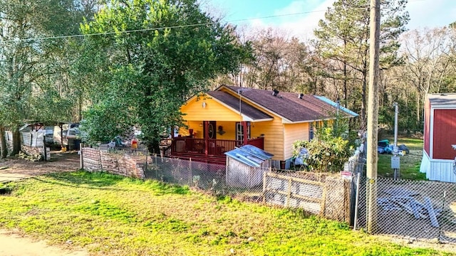 bungalow with fence and a front yard