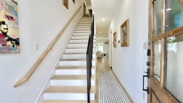 stairs featuring baseboards