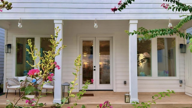 view of exterior entry with a porch